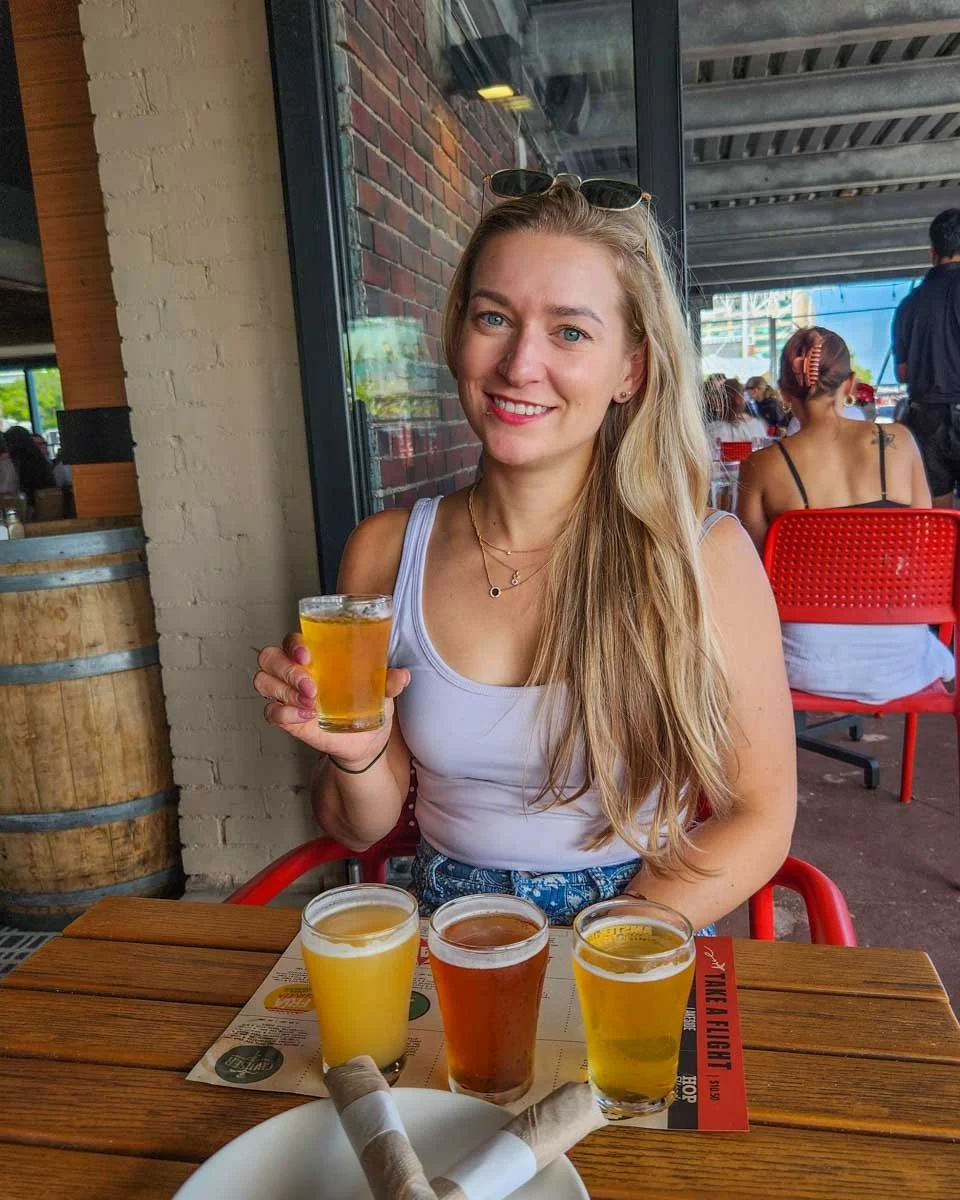 Bailey-drinks-craft-beer-at-Harpoon Brewery in Boston Massachusetts