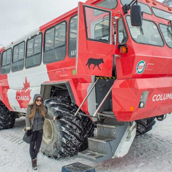 Bailey-poses-for-a-photo-with-an-Ice-Explorer-all-terrain-vehicle-on-the-Athabasca-Glacier-in-the-Columbia-Icefield-Canada