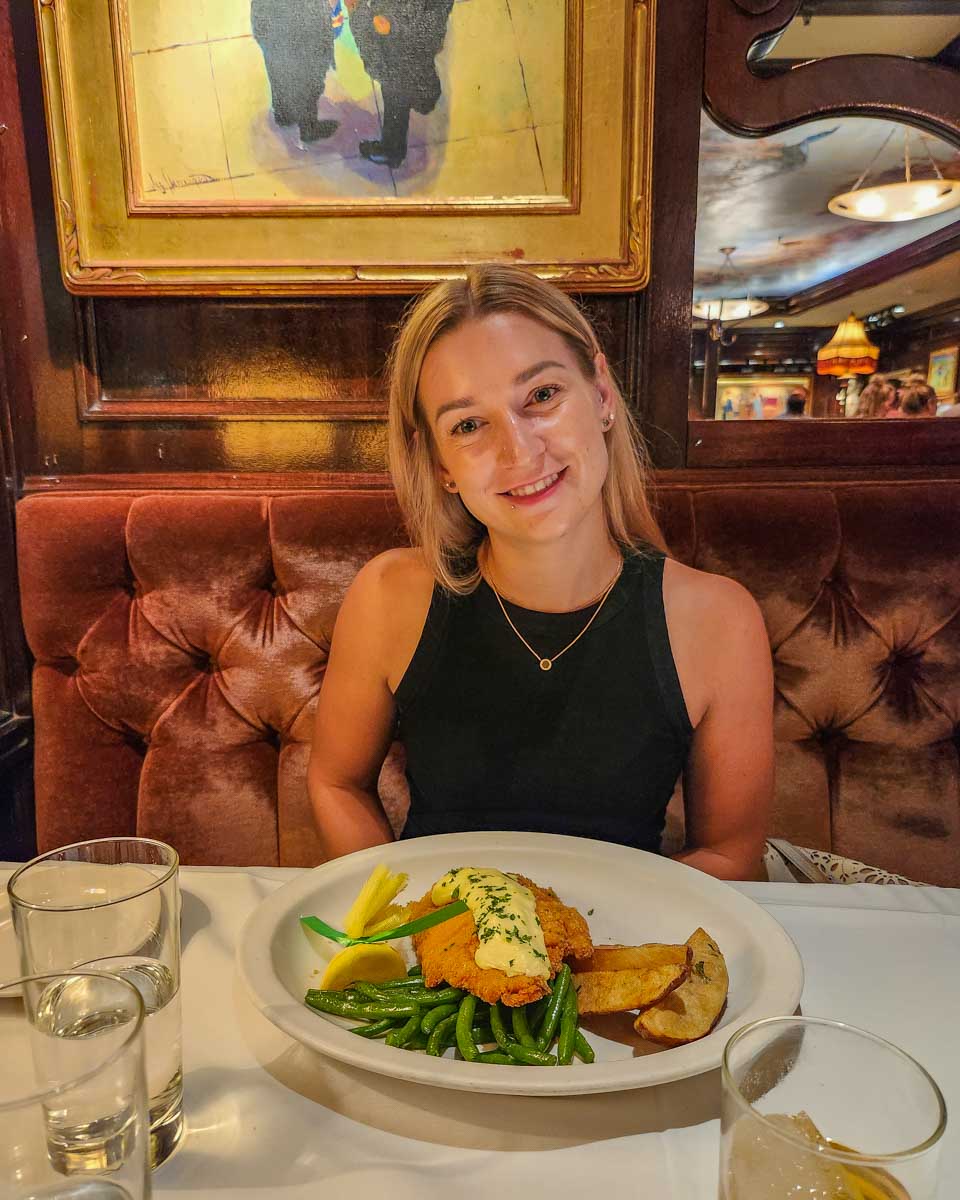 Bailey-sits-down-with-her-meal-in Zurich Switzerland