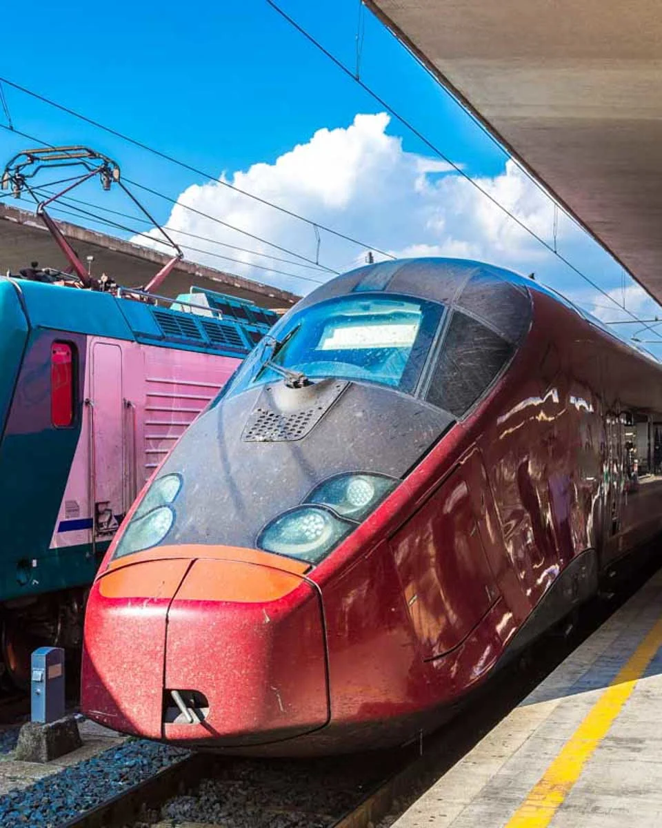 Two-trains-at-the-Santa-Maria-Novella-station-in-Florence-Italy