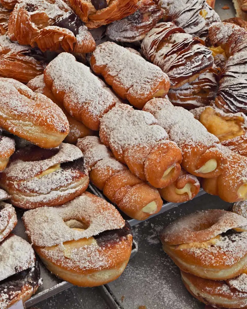 an assortment of pastries at a market in Rome Italy