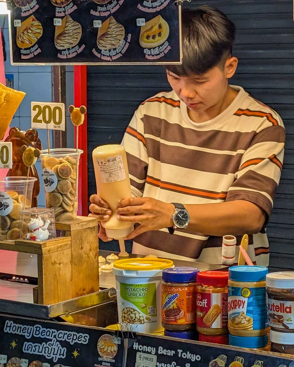 A man makes mini pancakes and icecream in Chinatown Bangkok Thailand (14)