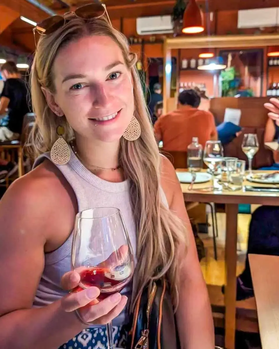 Bailey drinking wine at Bard & Banker in Victoria BC