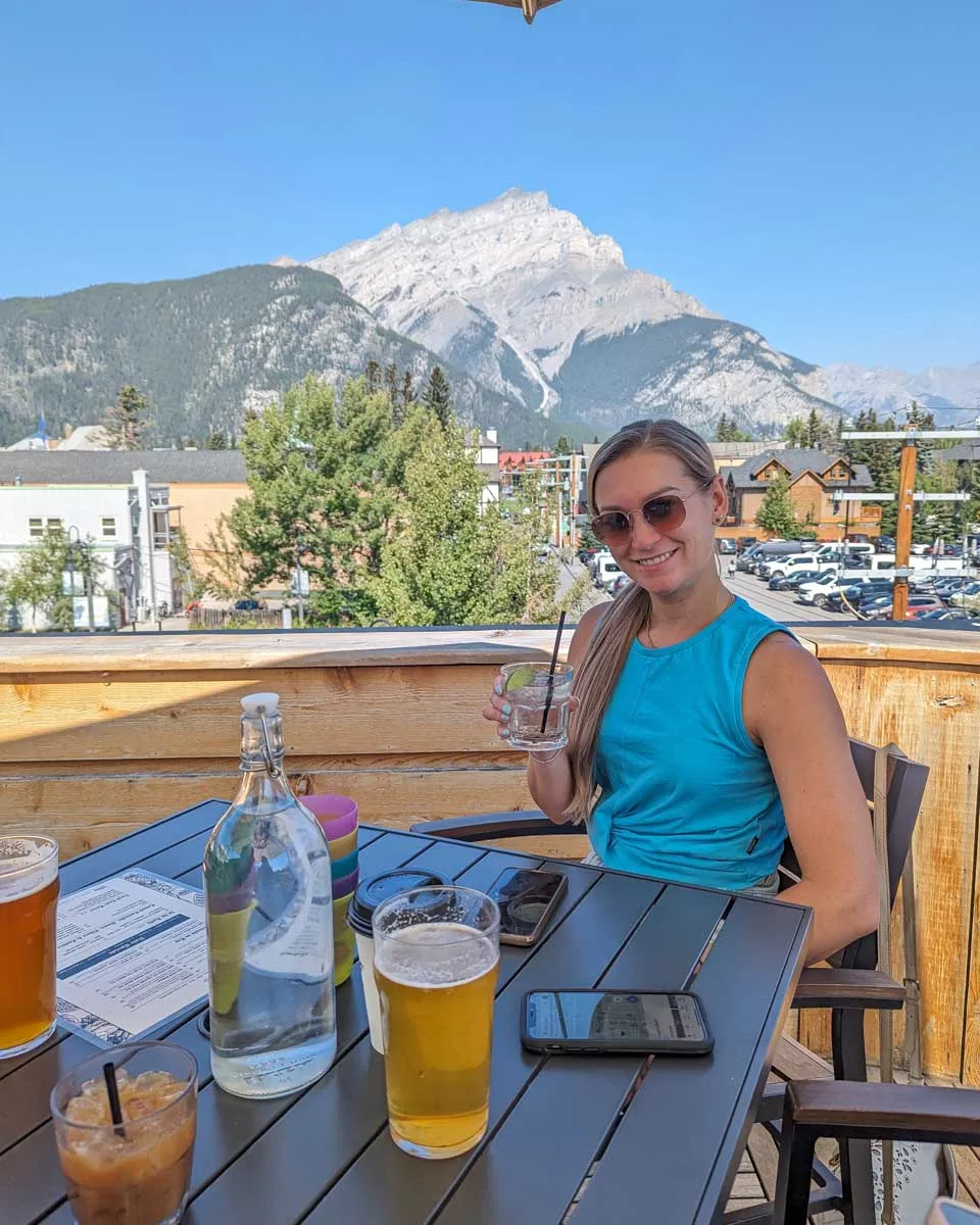 Bailey-enjoys-rooftop-drinks-in-Banff-Canada
