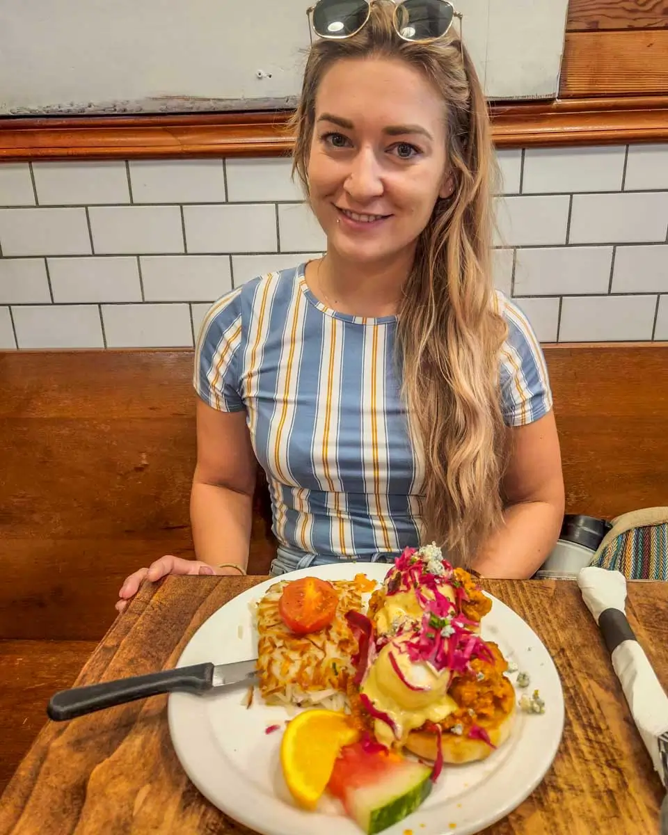 Bailey having eggs benedict at Jam Cafe in Victoria BC