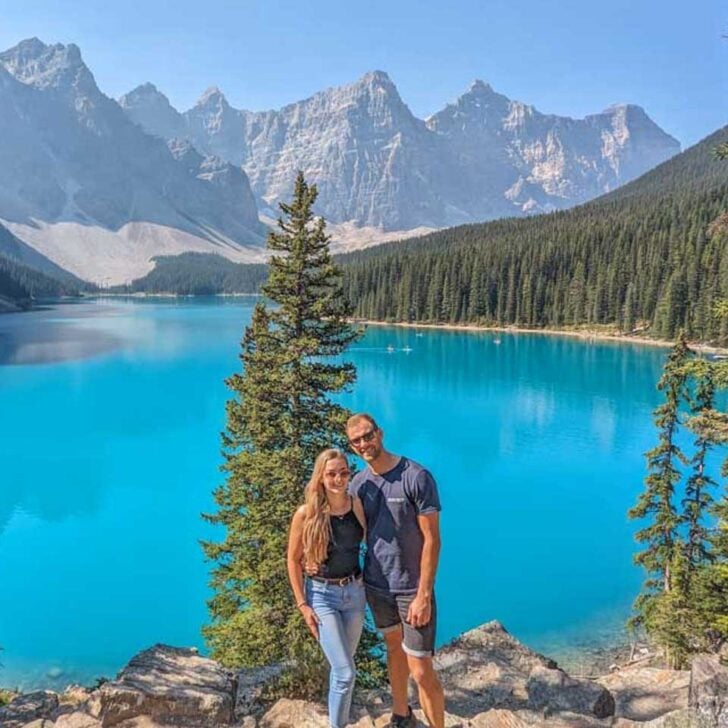 Daniel-and-Bailey-pose-for-a-photo-the-the-rockpile-at-Moraine-Lake on an icefields parkway tour