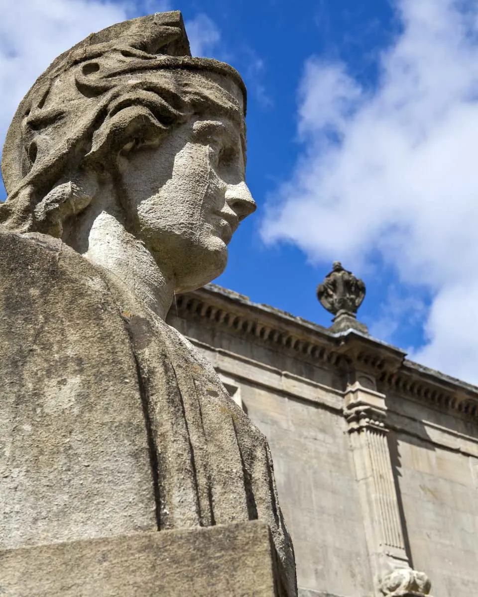 Statues at the Roman Baths seen on a tour to Windsor Castle from London England