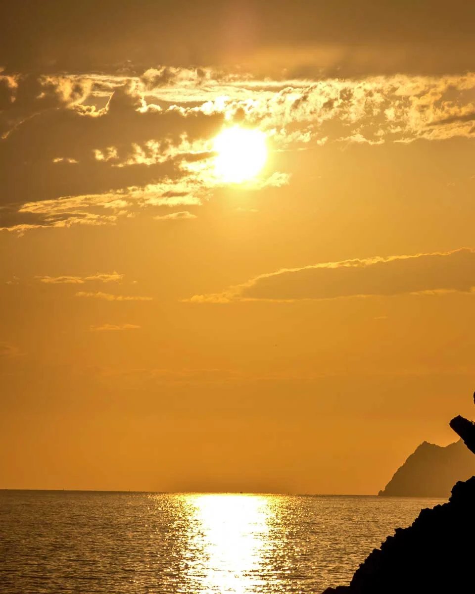 The sunset seen on a boat tour from Manarola Cinque Terre Italy