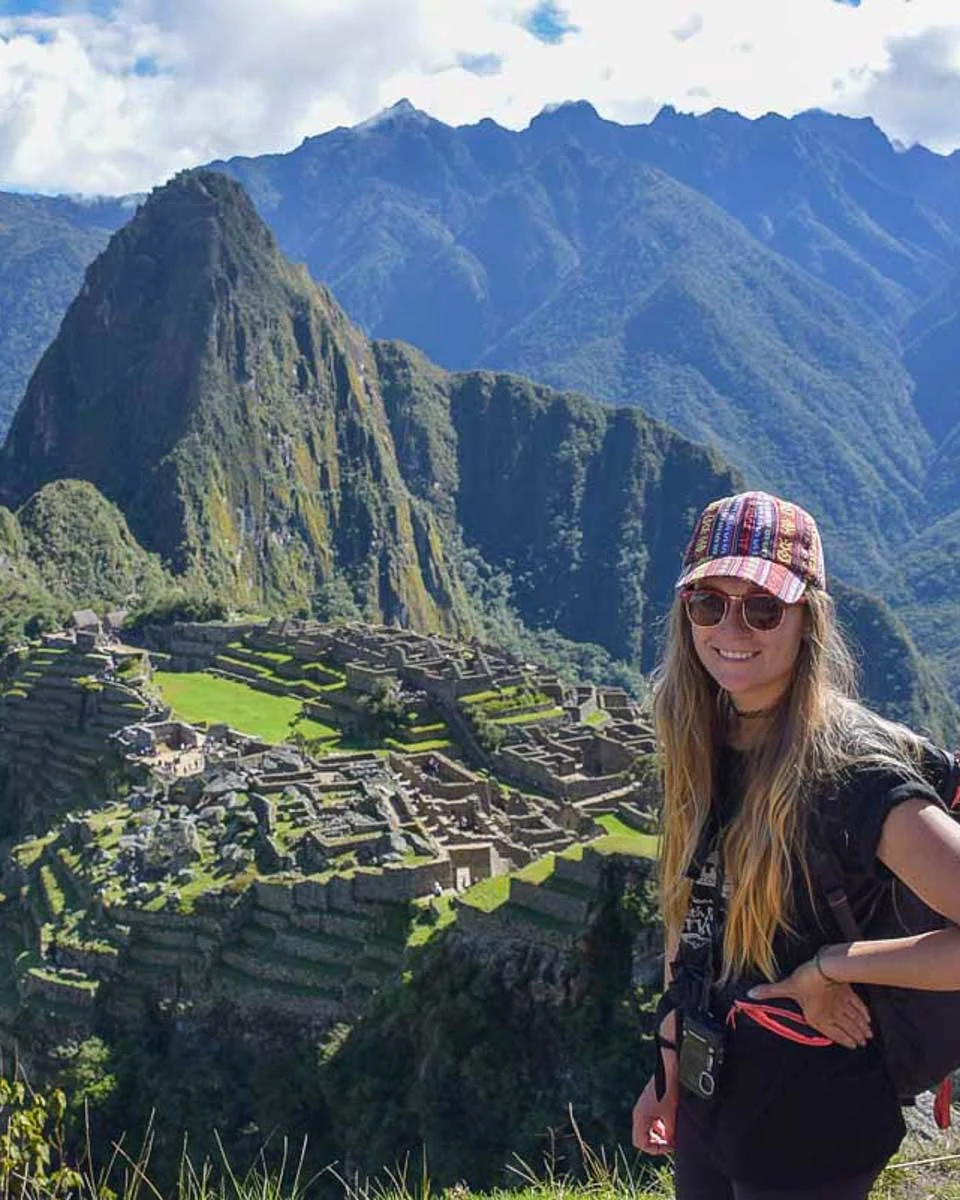 Bailey-poses-for-a-photo-with-Machu-Picchu on a tour from Cusco Peru