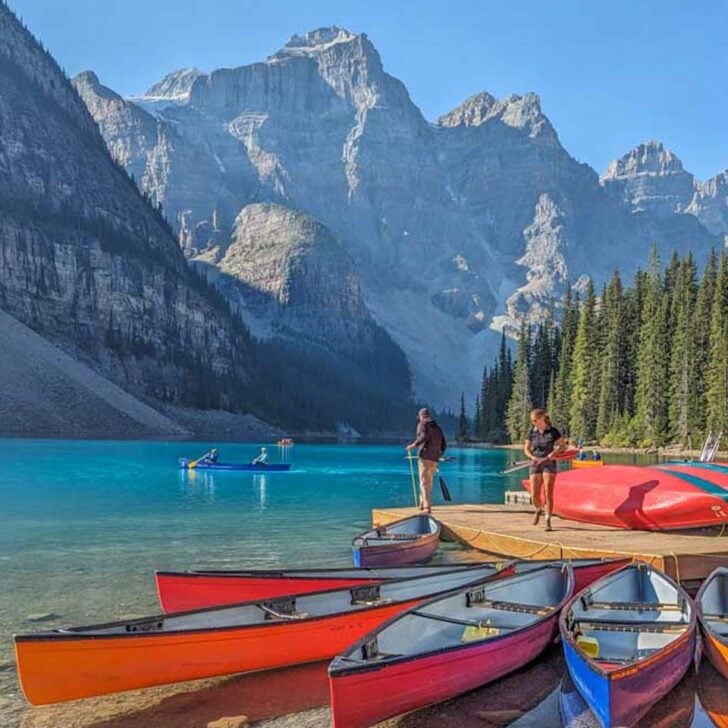 Canoes-sit-in-the-water-at-Moraine-Lake-Banff-National-Park on a tour from Calgary Alberta