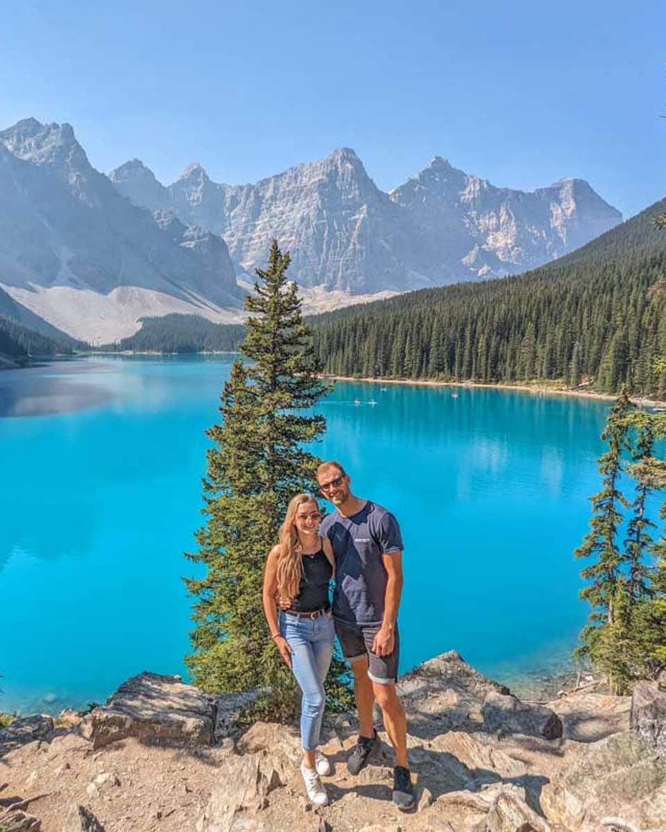 Daniel-and-Bailey-pose-for-a-photo-the-the-rockpile-at-Moraine-Lake-on-a tour from Calgary Alberta