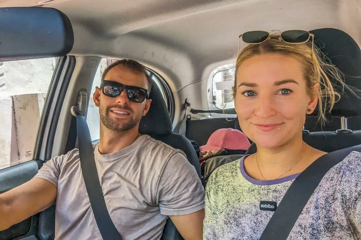 Daniel-and-Bailey-take-a-selfie-driving-in-their-rental-car-in Austin Texas