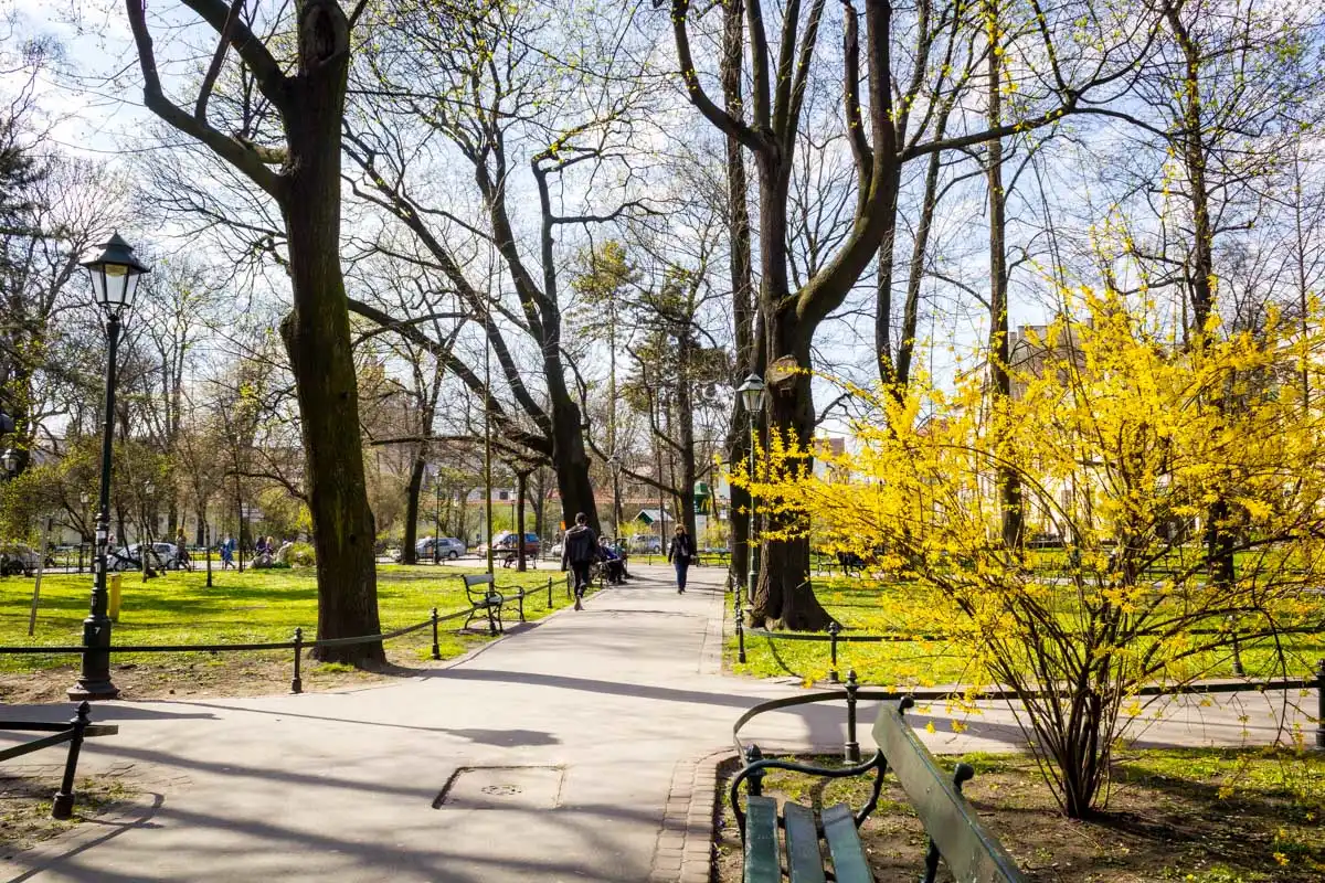 People walk in Planty Park Krakow Poland 1