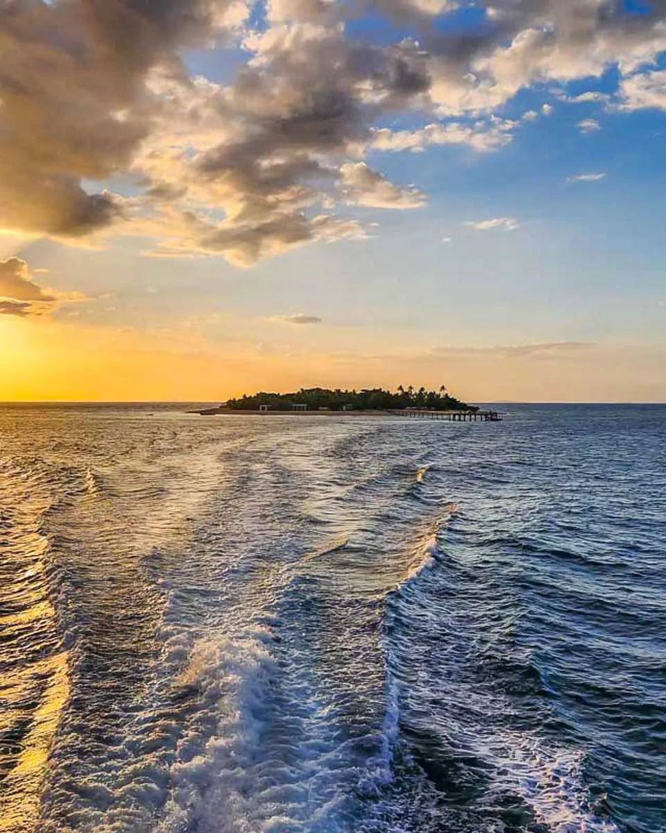 Sunsets-behind-an-island-on-a-sunset-and-cultural-cruise-in-Fiji