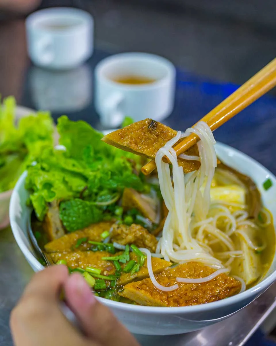 A-person-eats-Vietnamese food in Melbourne Australia