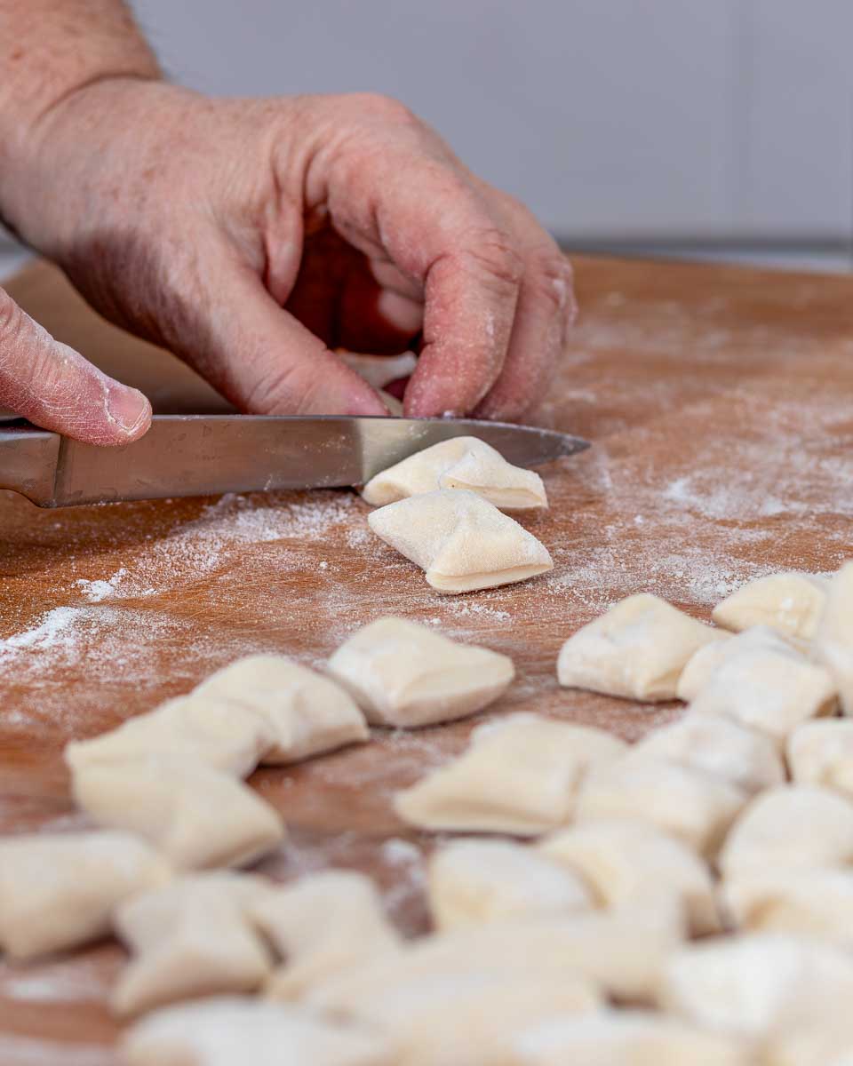A-person-makes-gnocchi-during-a-cooking-class-in-Livorno-Italy
