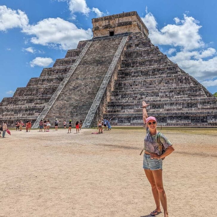 Bailey-poses-for-a-photo-in-front-of-El-Castillo-Pyramid-at-Chichen-Itza-Mexico on a tour from Tulum