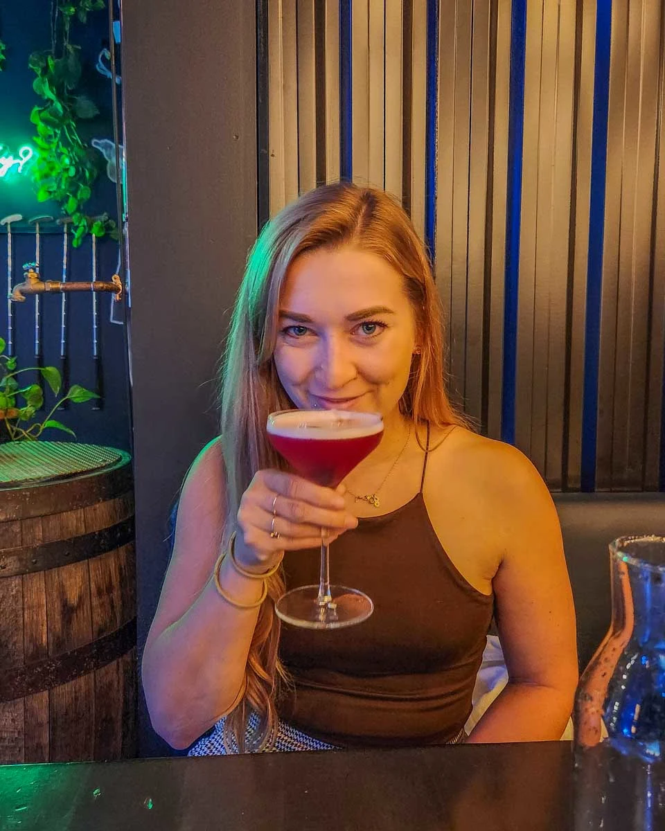 Bailey-sips-a-cocktail-in-Hong-Kong