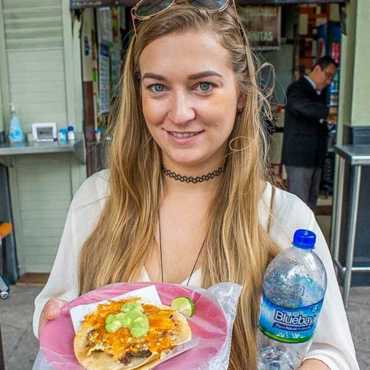 Bailey-with-a-shrimp-taco-on-a-food-tour-of-Cabo San Lucas Mexico