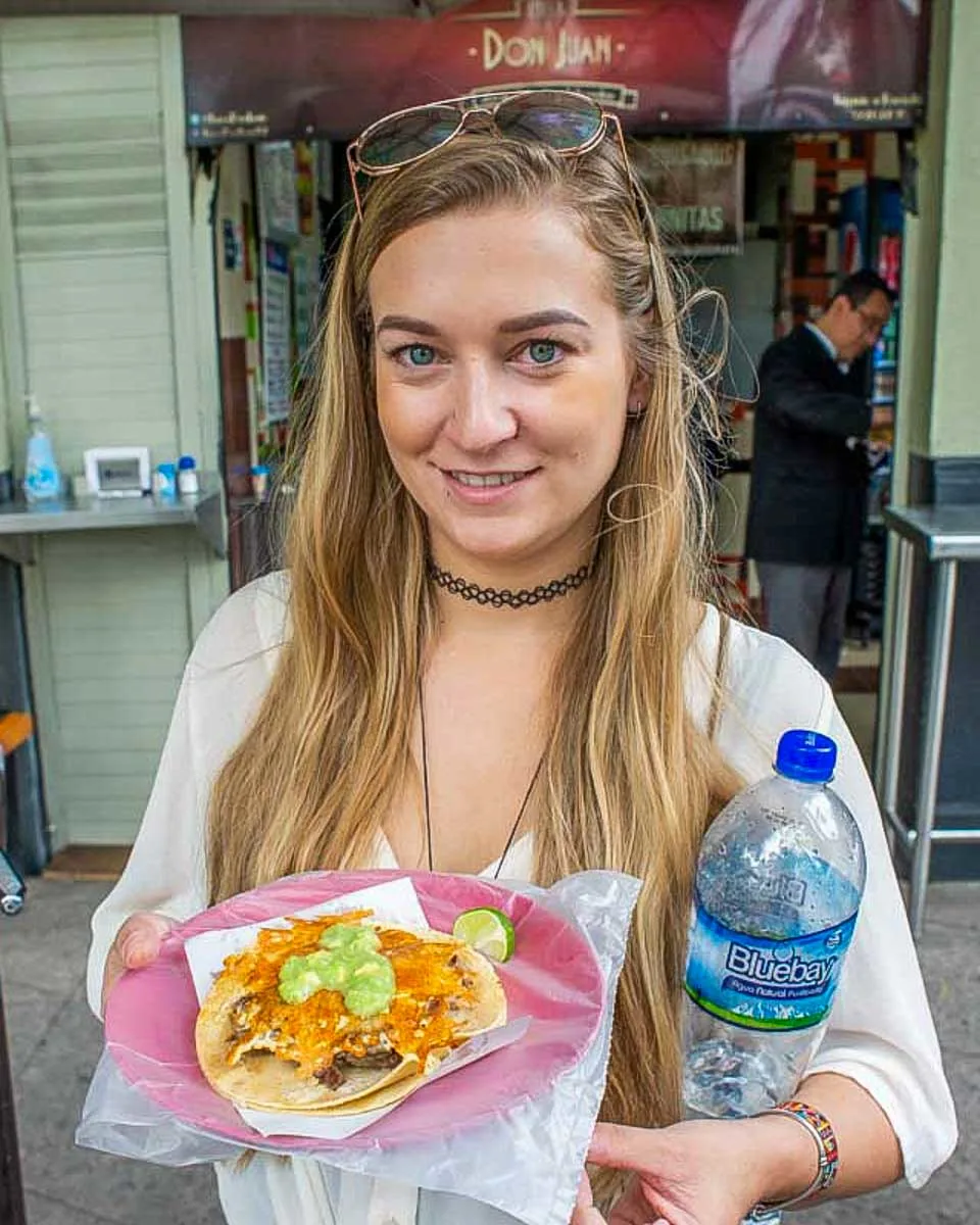 Bailey-with-a-shrimp-taco-on-a-food-tour-of-Cabo San Lucas Mexico