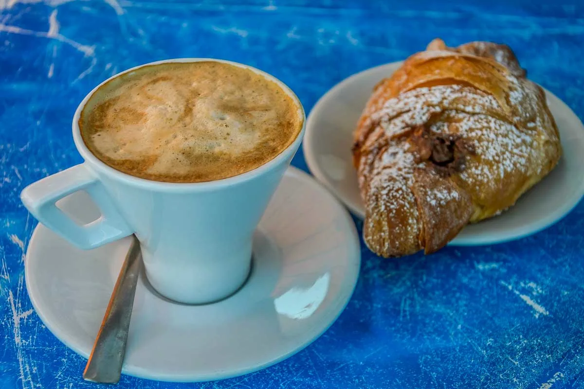 Cappuccino-with-croissant-for-breakfast-in-Catania Sicily