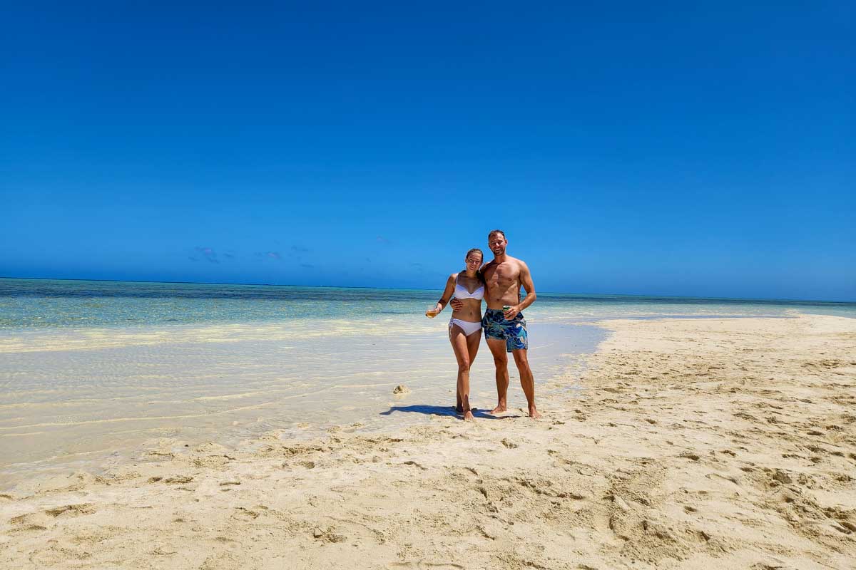 Bailey-and-Daniel-posing-for-a-picture-on-a-the-beach-in the San Blas Islands near Panama City Panama
