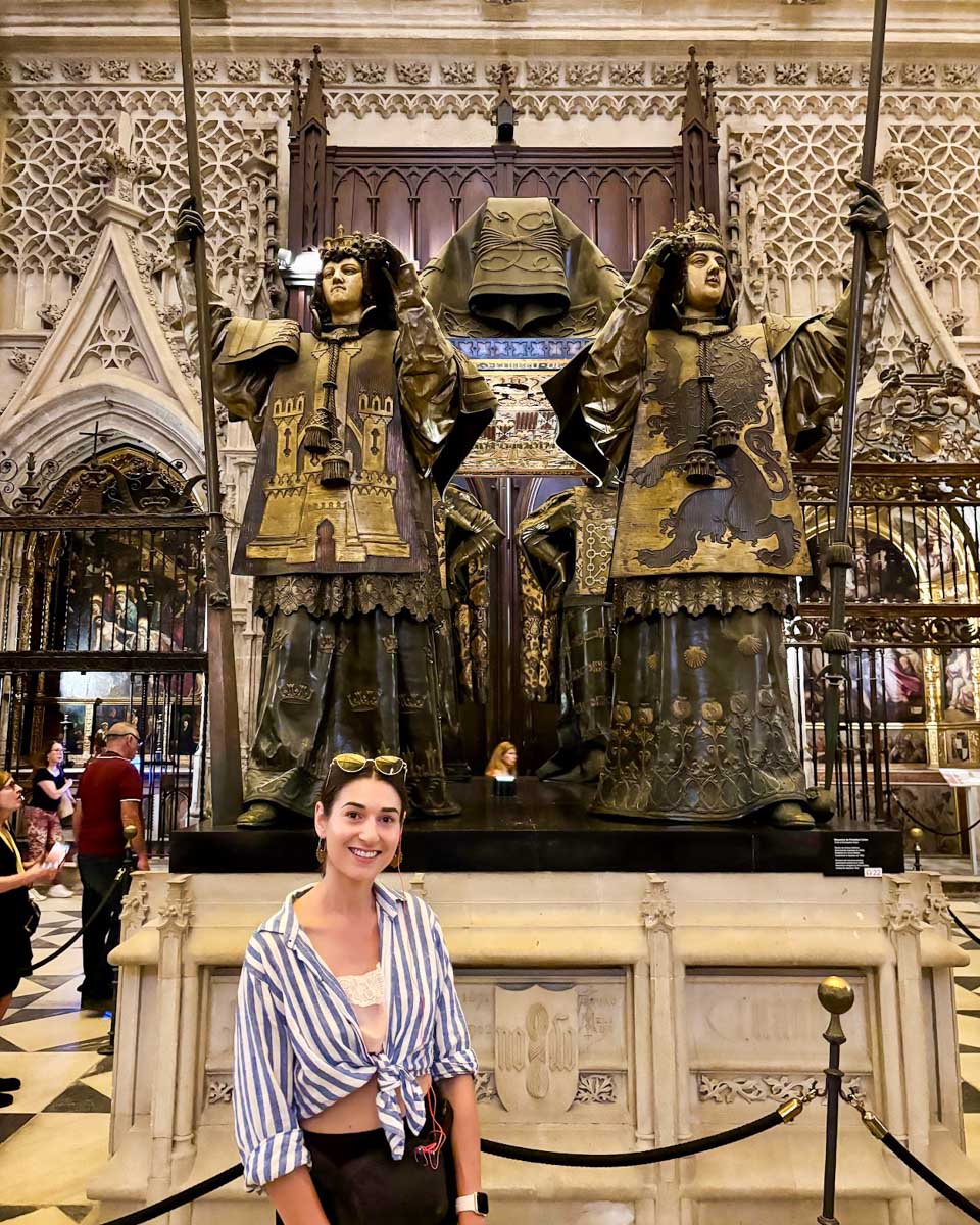 Brittni poses in front of Christopher Columbus' tomb in the Seville Cathedral