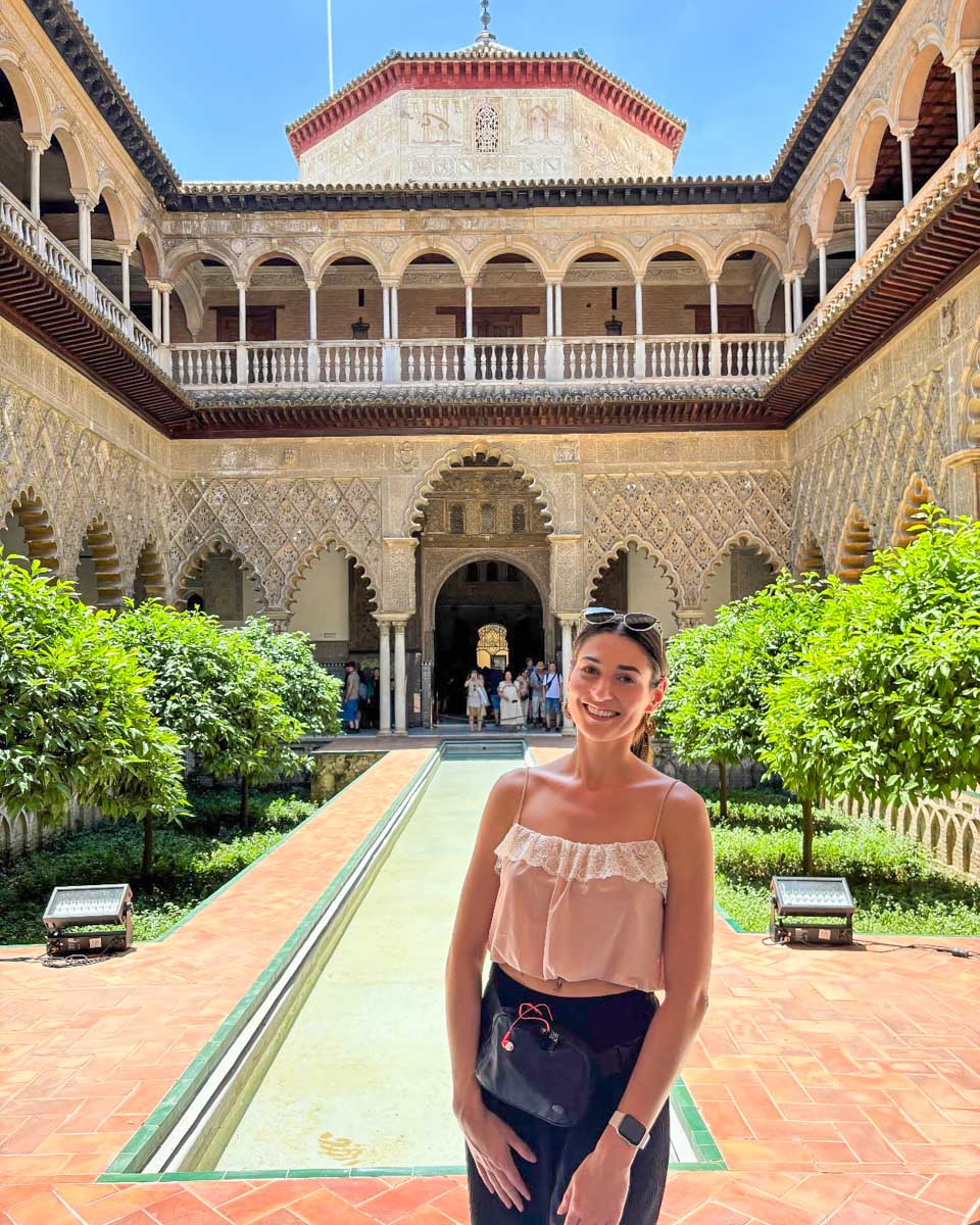 Brittni poses in the courtyard of the Royal Alcazar of Seville