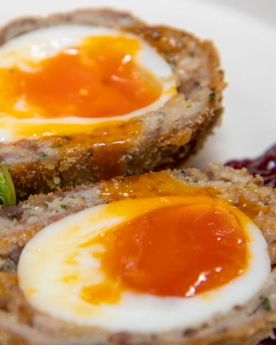 Caribbean spiced scotch egg eaten on a food tour in Bermuda