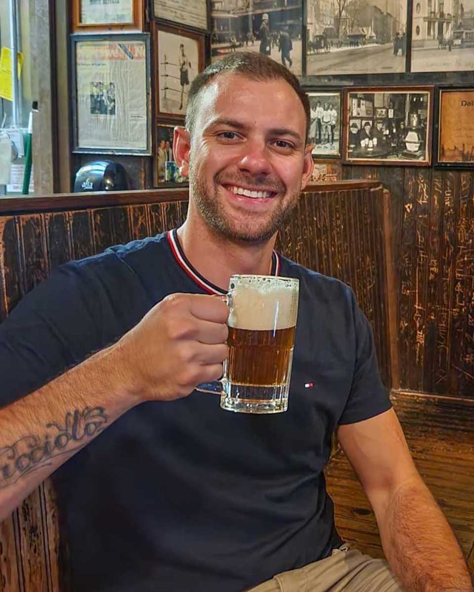 Daniel-poses-for-a-photo-at-a-pub-in-Brussels Belgium