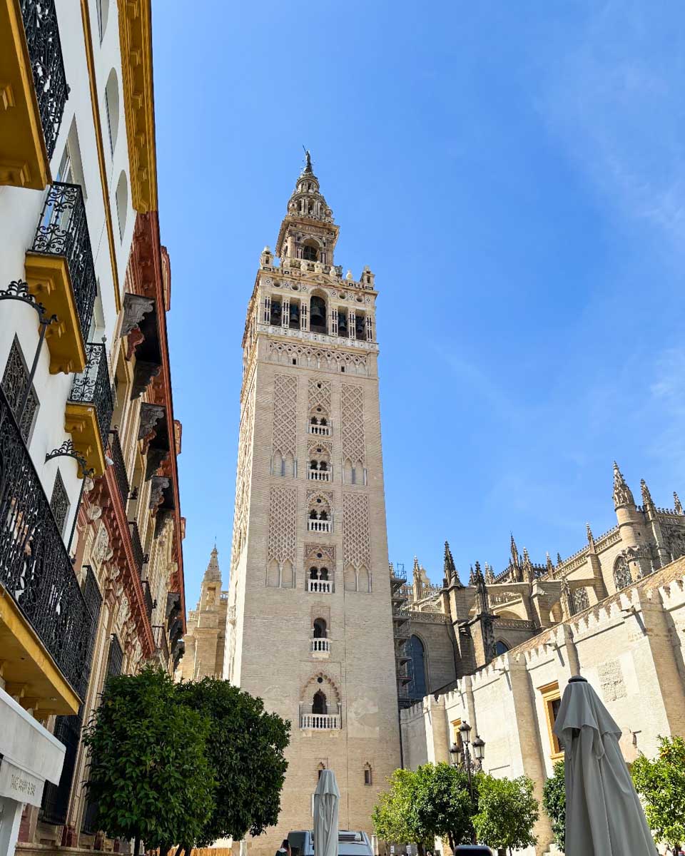 Looking up at La Giralda bell tower from the street below