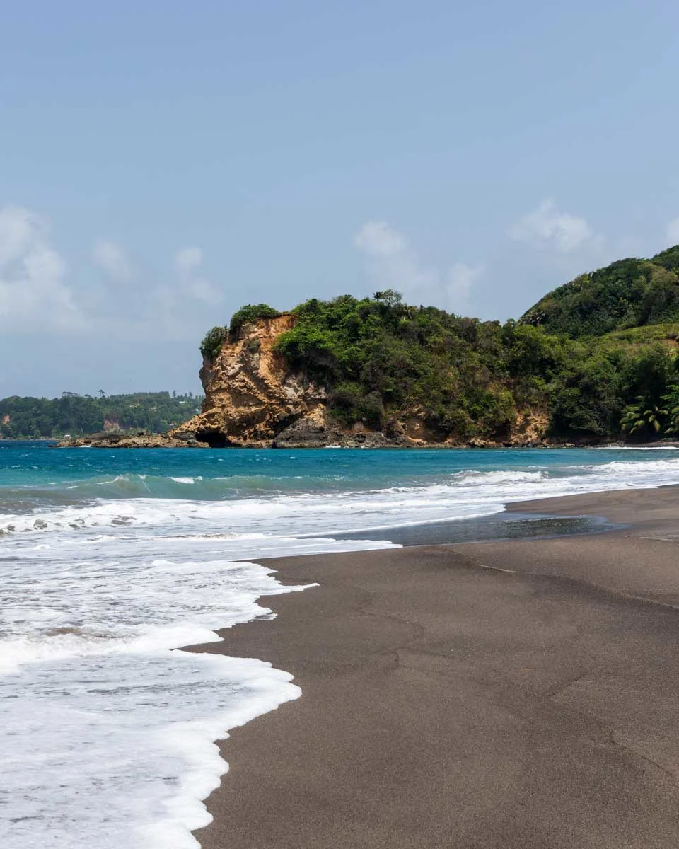 A black sand beach on the island of Dominica