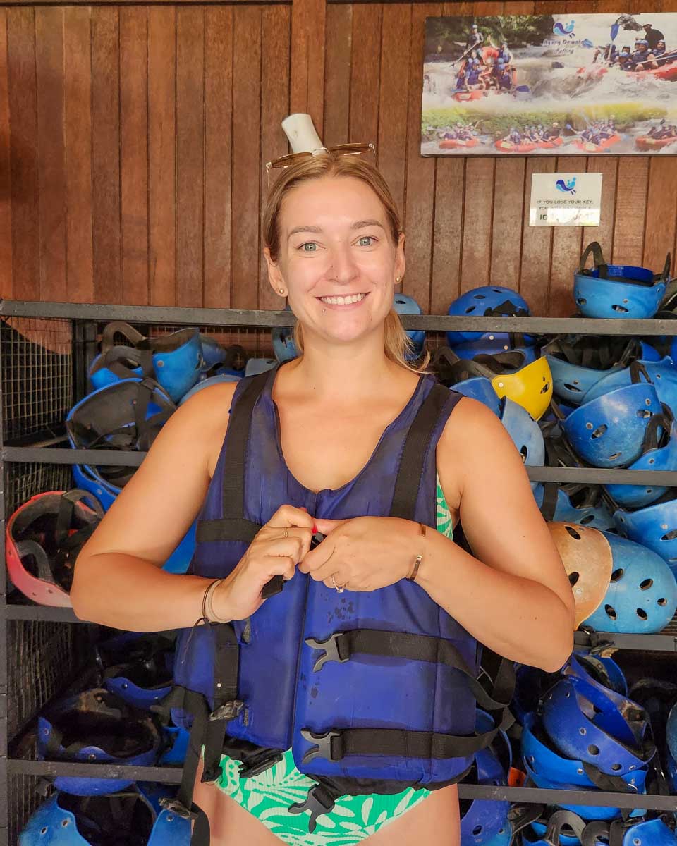 Bailey-putting-on-safety-gear-for-river-tubing-in-Dominica