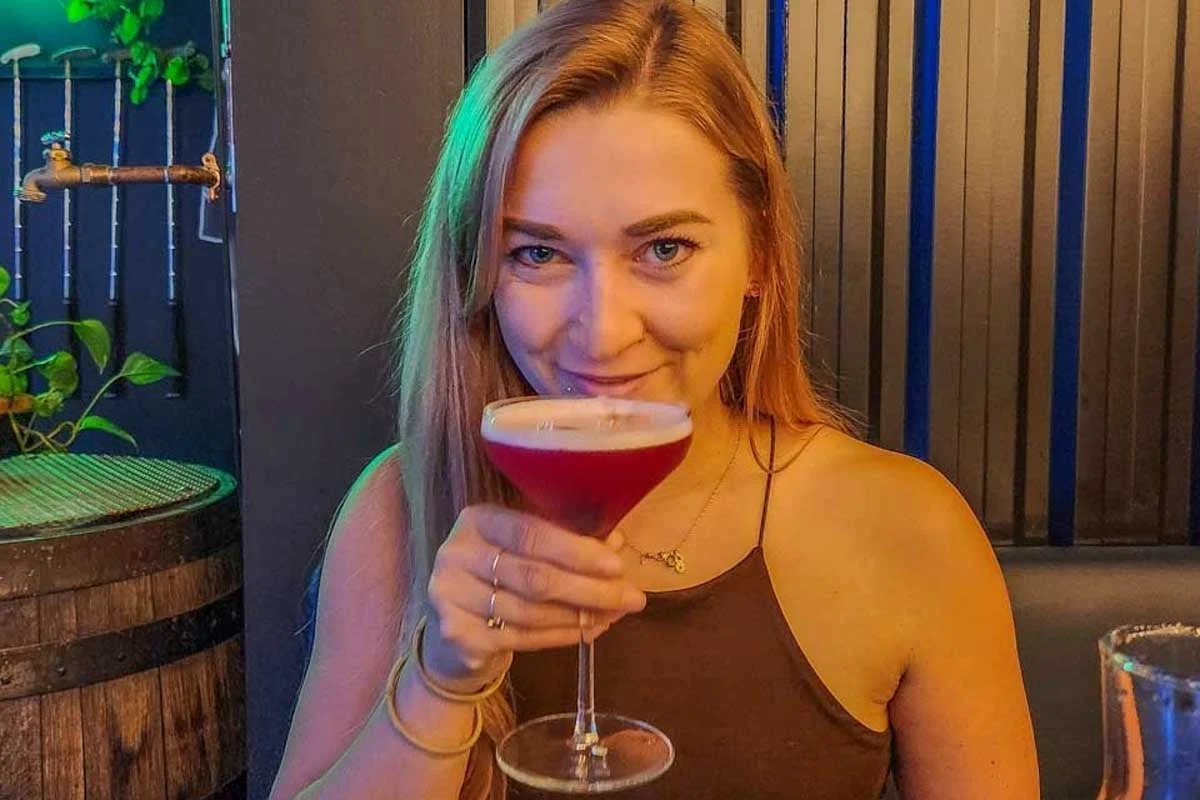 Bailey-sips-a-cocktail-in Sao Paulo Brazil