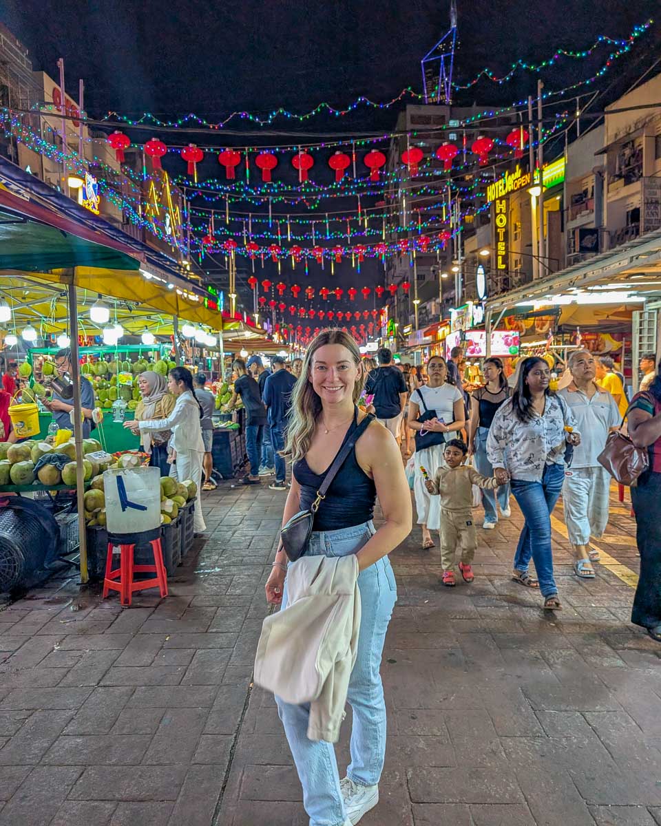 Bailey walks through Jalan Alor Food Street in Kuala Lumpur, Malaysia