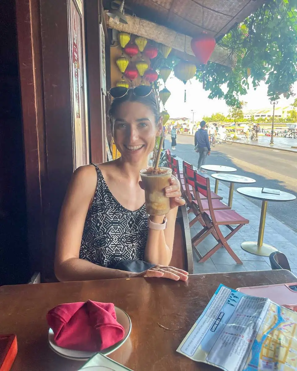 Brittni enjoying coffee at a cafe in Ho Chi Minh, Vietnam