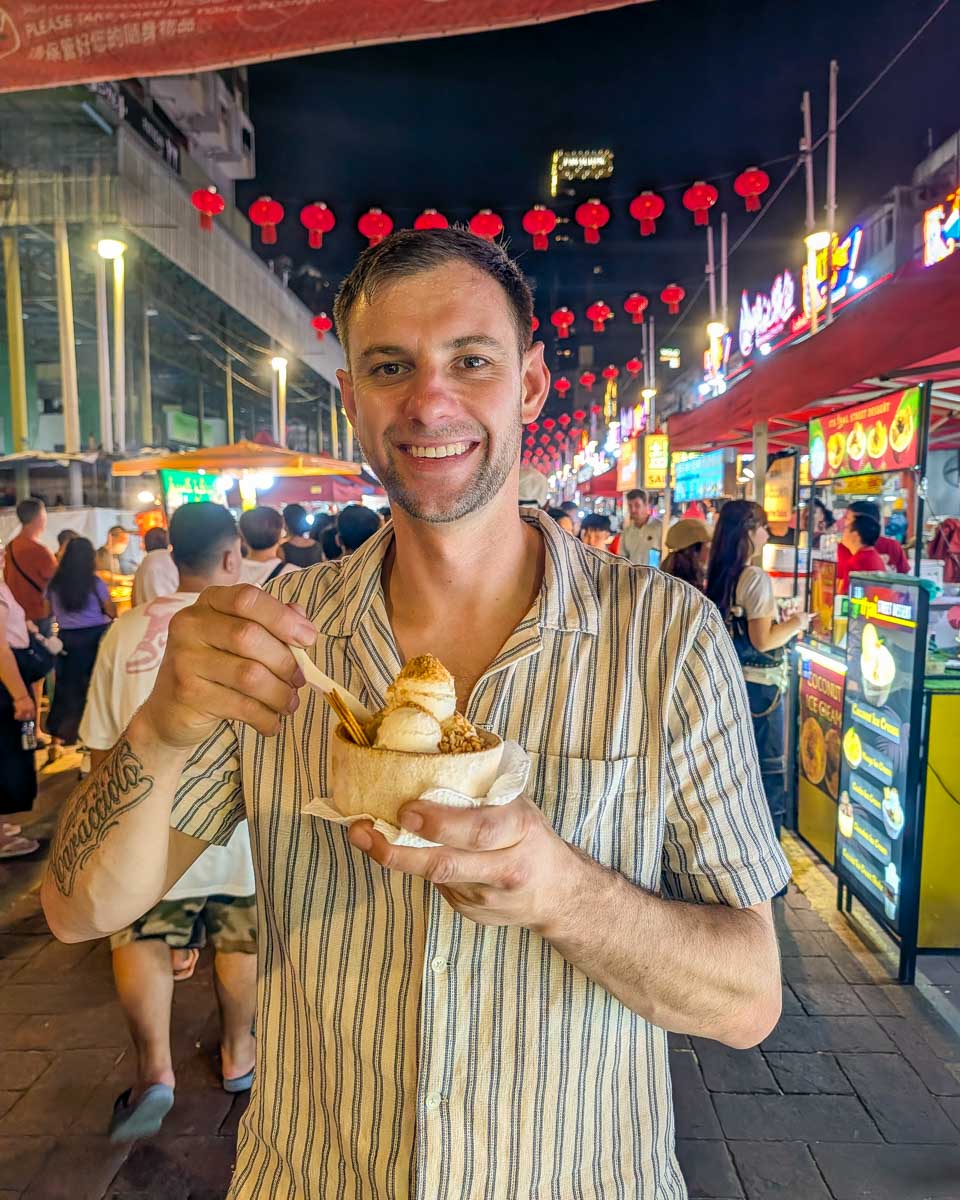 Daniel walks through Jalan Alor Food Street in Kuala Lumpur, Malaysia
