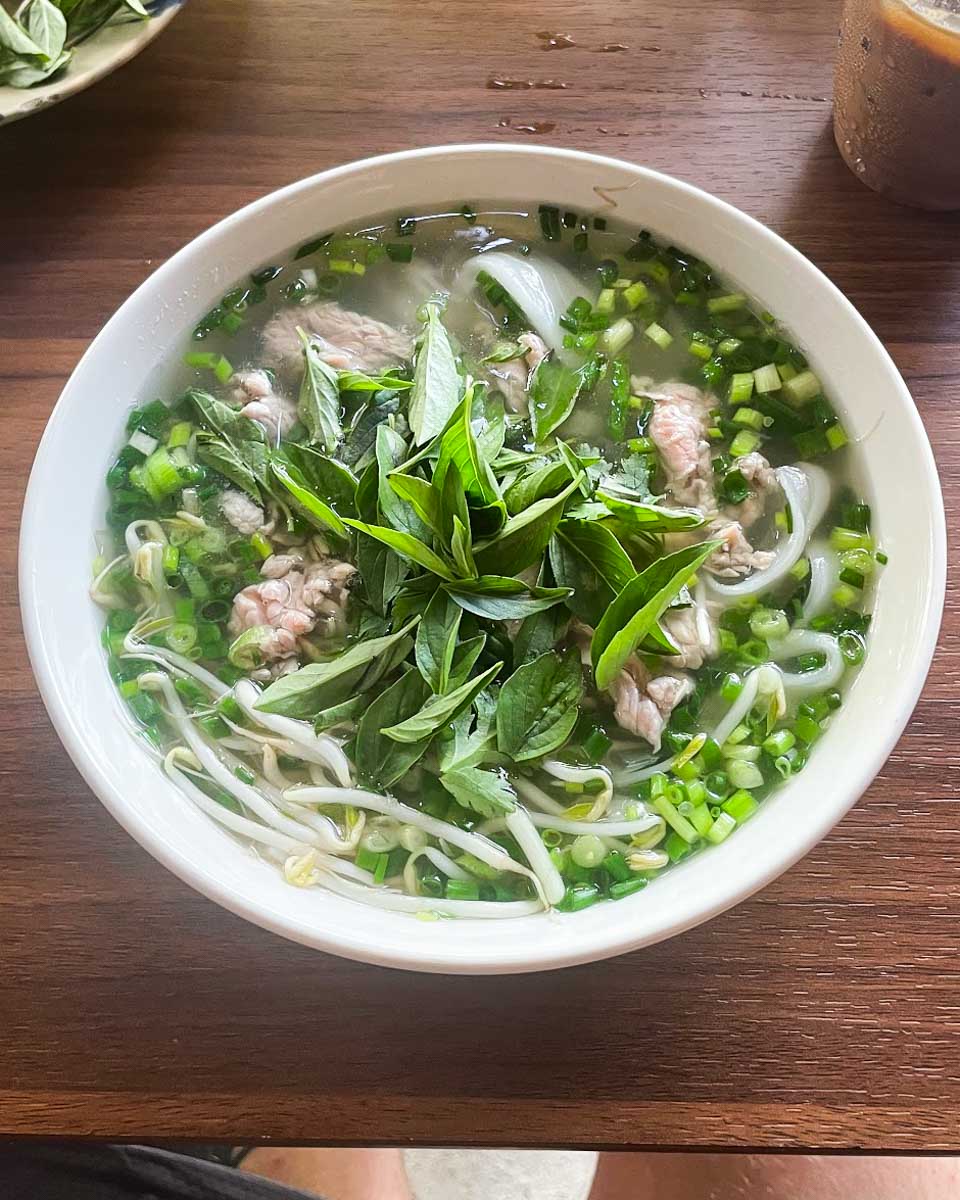 Eating pho made in a cooking class in Hanoi, Vietnam