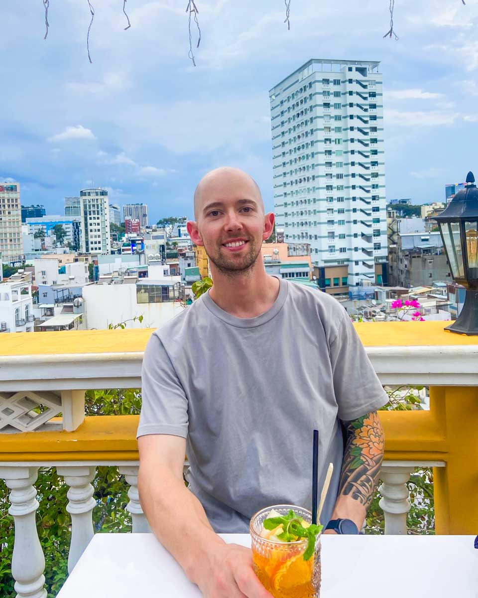 Jesse drinks a cocktail at the View Rooftop bar in Ho Chi Minh