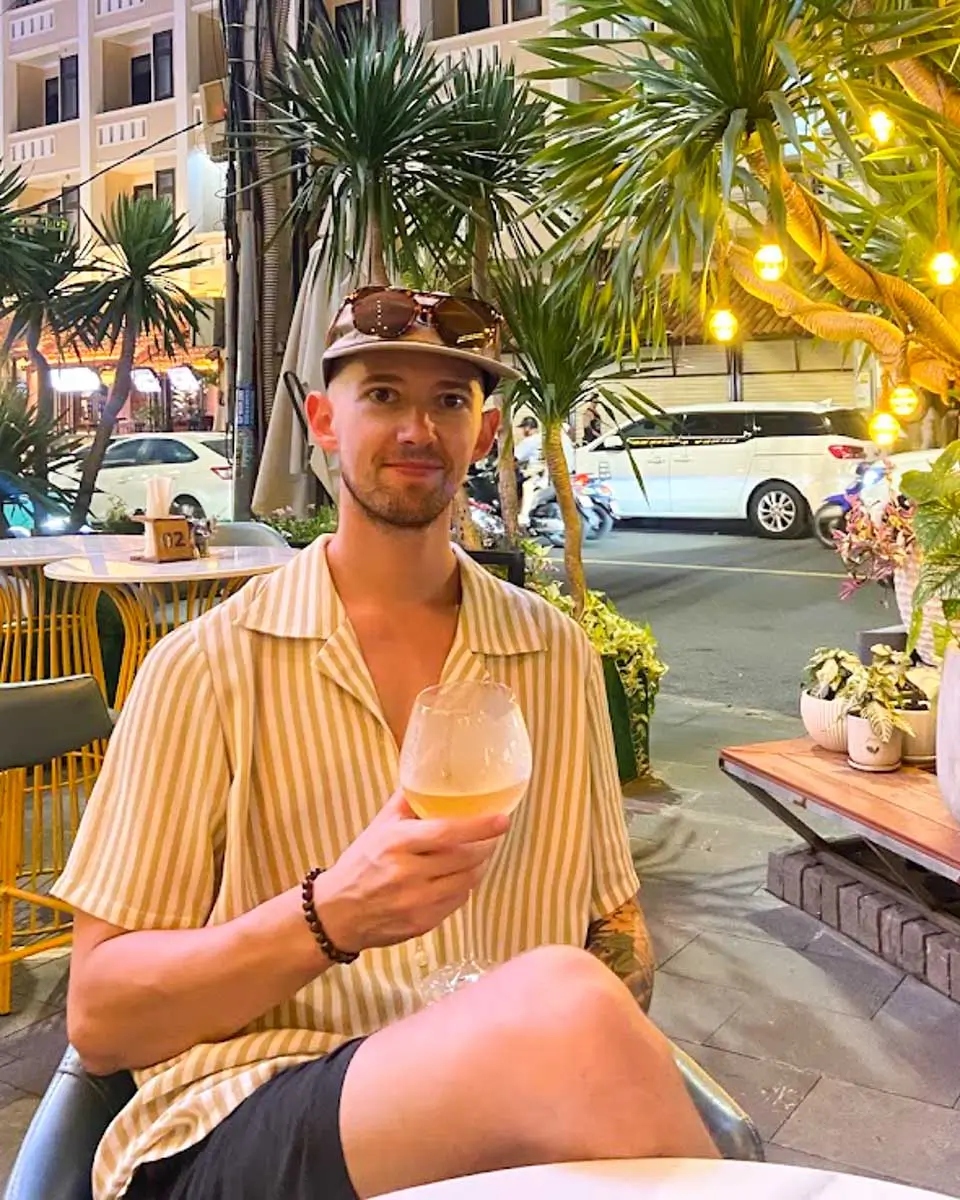Jesse having a drink at a restaurant in District 7, Vietnam