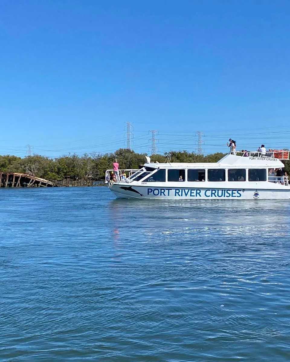 A boat from Port River Cruises looking for dolphins in Adelaide