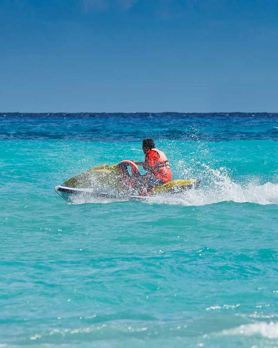 A-person-rides-a-jet-ski-near Airlie Australia