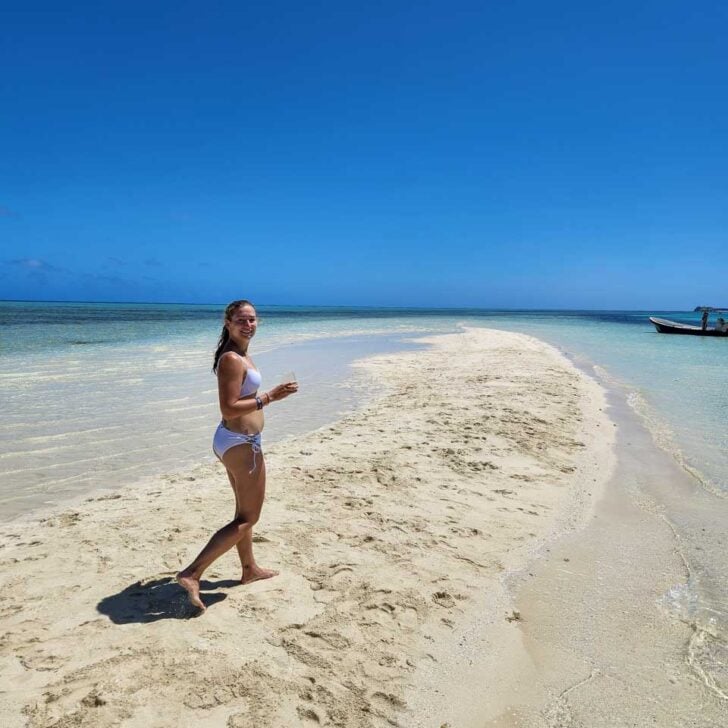 A-woman-enjoys-the beach on a tour of Bora Bora