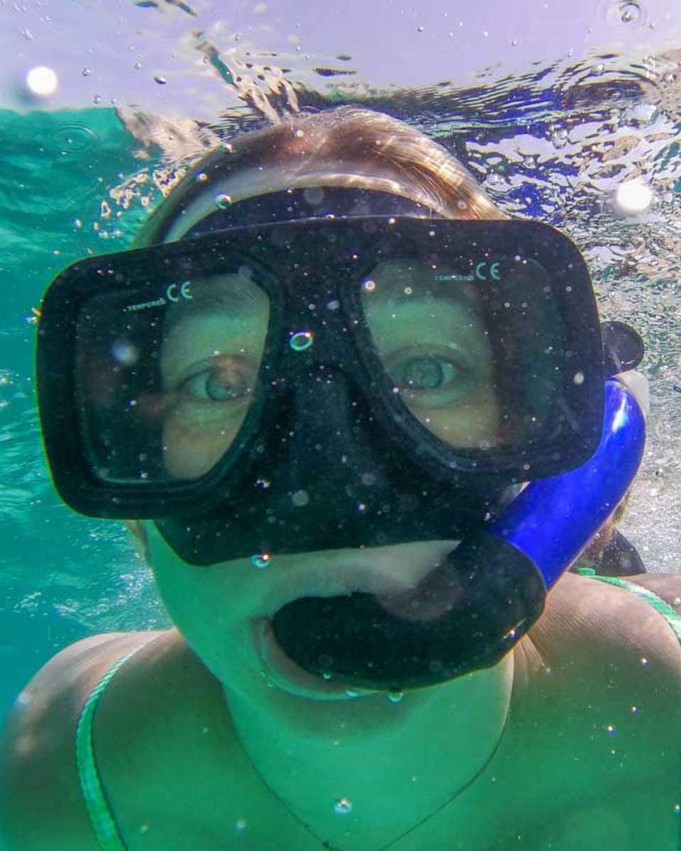 Bailey-under-the-water-while-snorkeling-with whales in Bora Bora