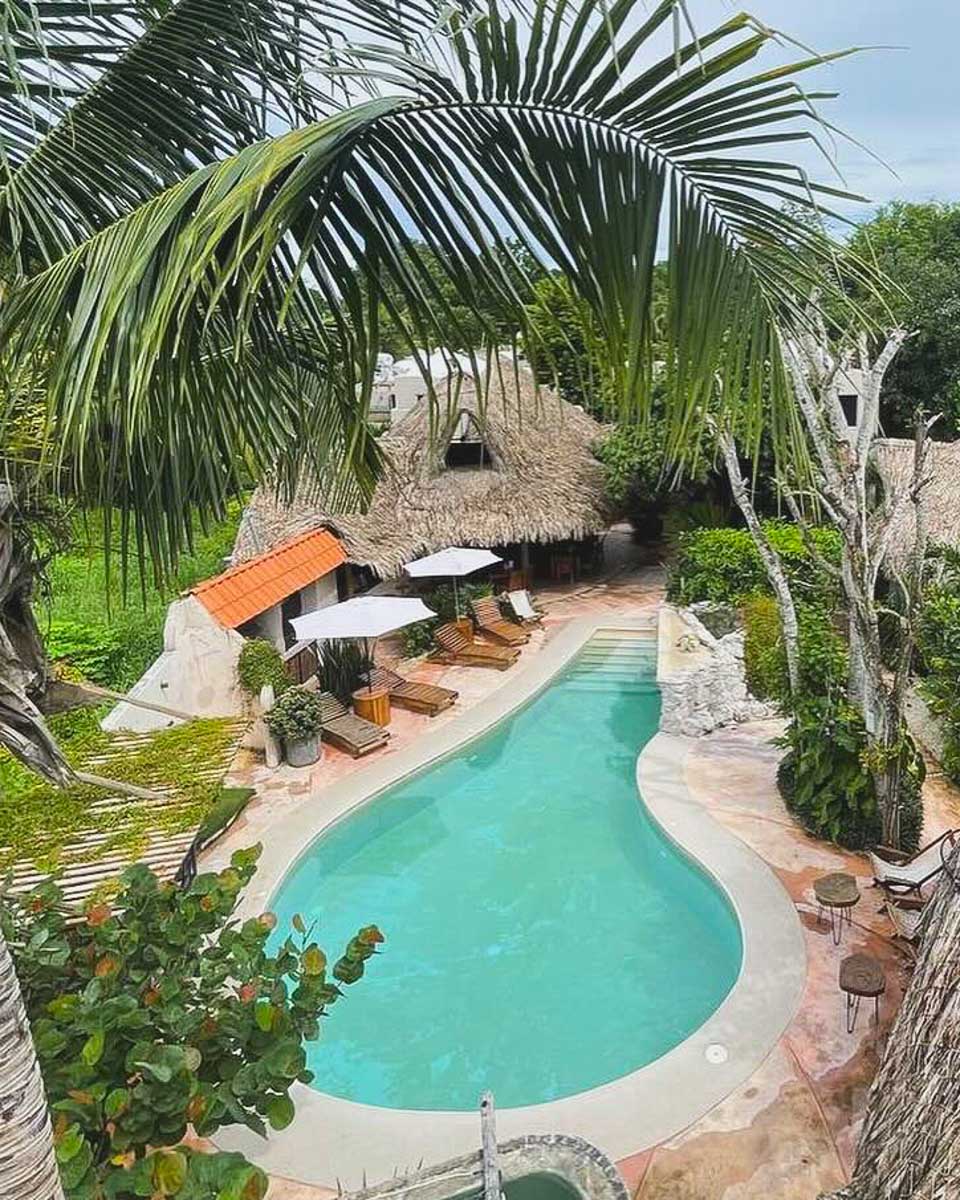 View of the pool area at Hotel Círculo Bacalar, Mexico
