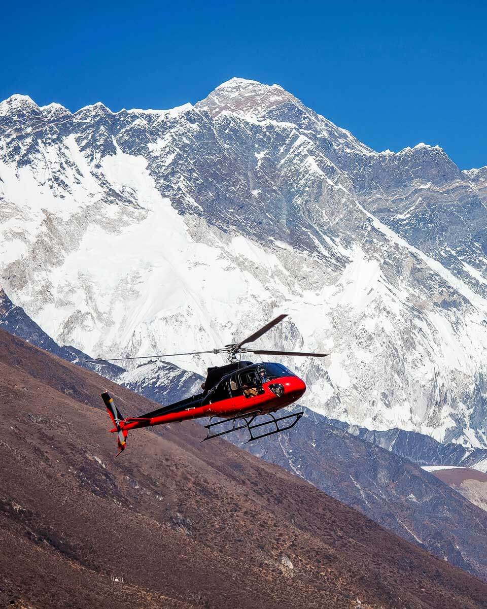 A helicopter flying through the Himalayas on a tour from Kathmandu Nepal