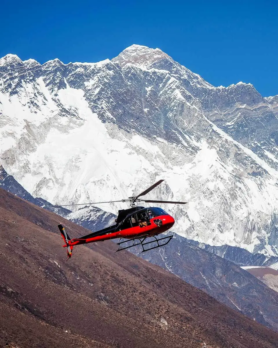A helicopter flying through the Himalayas on a tour from Kathmandu Nepal