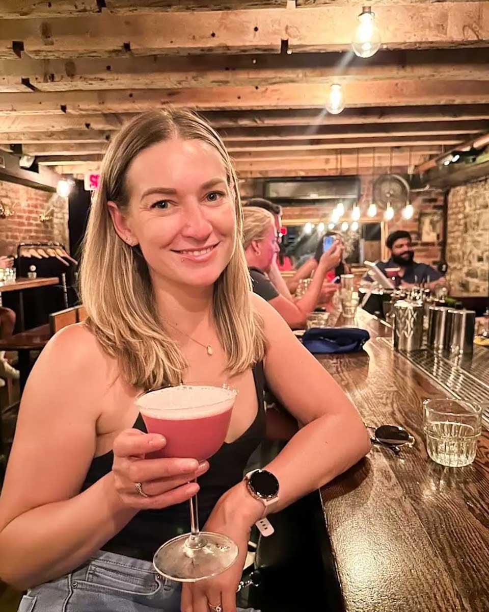 Bailey holding the drink at the Coldroom speakeasy in Montreal, Quebec