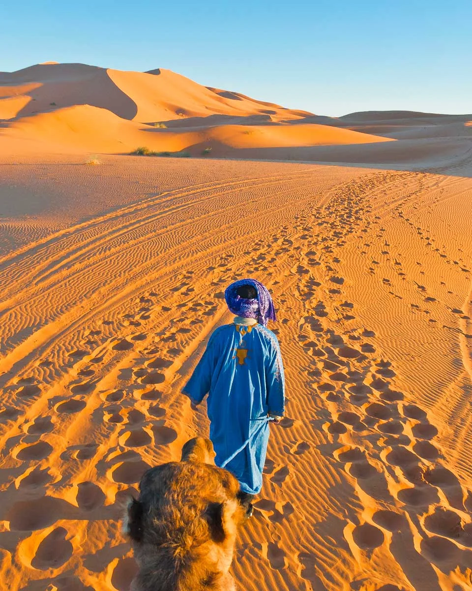 Riding-a-camel-through-the-desert on a tour from Essaouira, Morocco