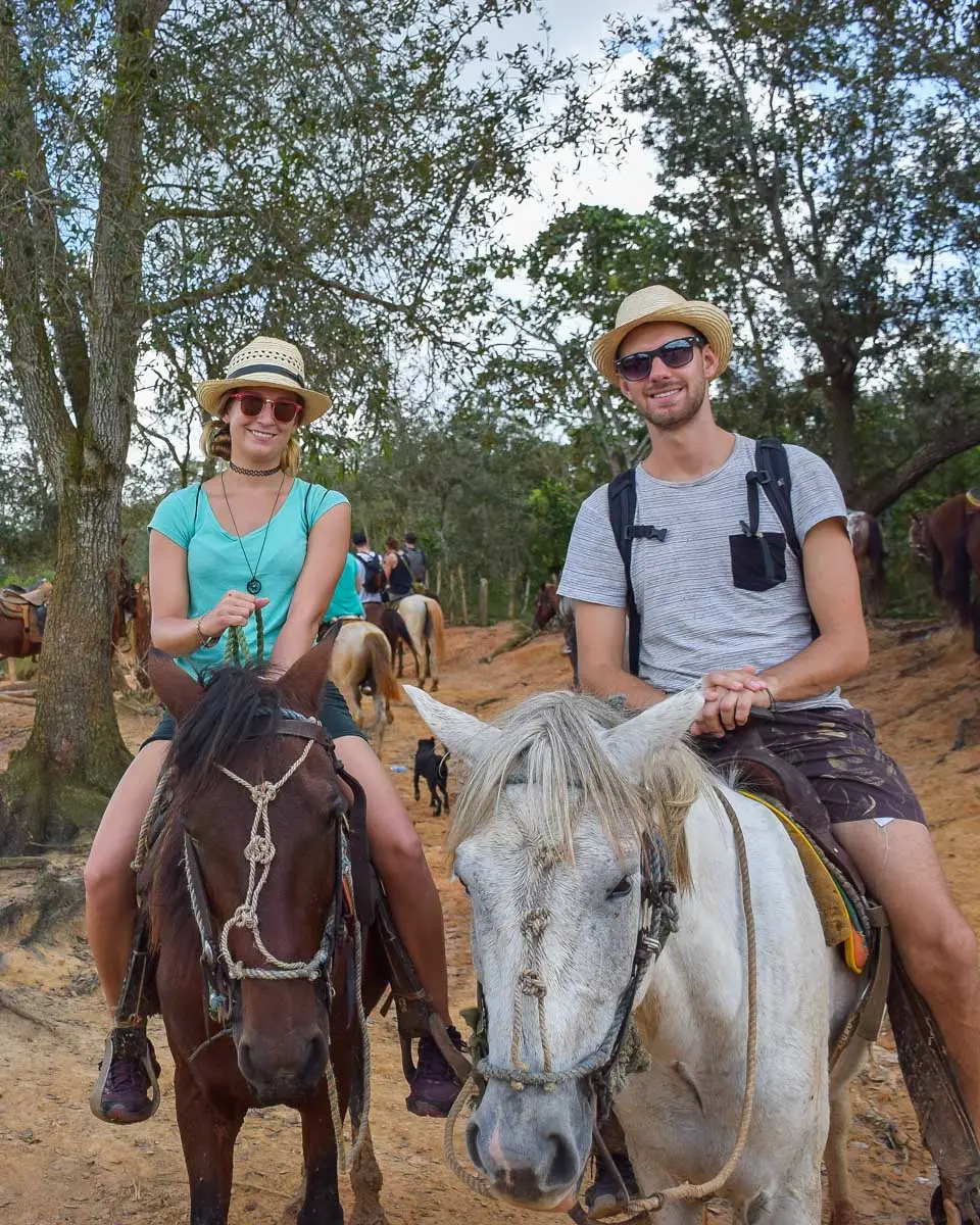 Bailey-and-Daniel-pose-for-a-photo-while-horseback-riding-in-San Ignacio Belize